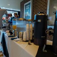 Person grabbing beverages in Kirkhof Center lobby.